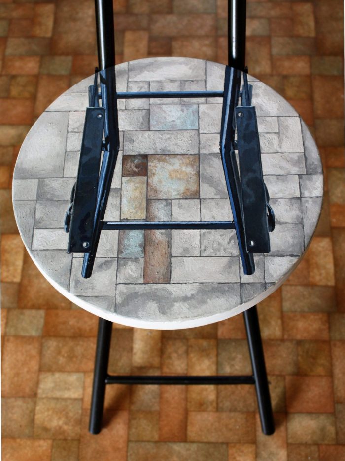 Painting of a stool from above with another stool on top. Painting by Irish Artist David O'Rourke