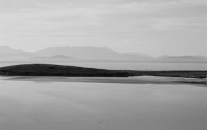 Photo of Achill Island, Mayo, Ireland showing a peninsula and grey sky by Irish Artist David O'Rourke