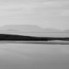 Photo of Achill Island, Mayo, Ireland showing a peninsula and grey sky by Irish Artist David O'Rourke