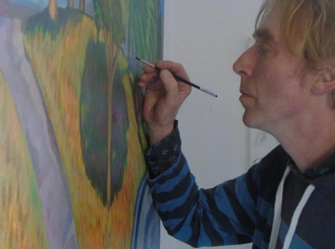 rish Artist David O'Rourke in action painting an image of Australia